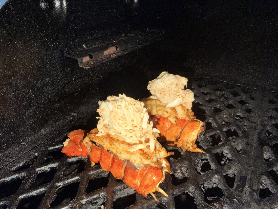 Lobster tails stuffed with crab on the grill