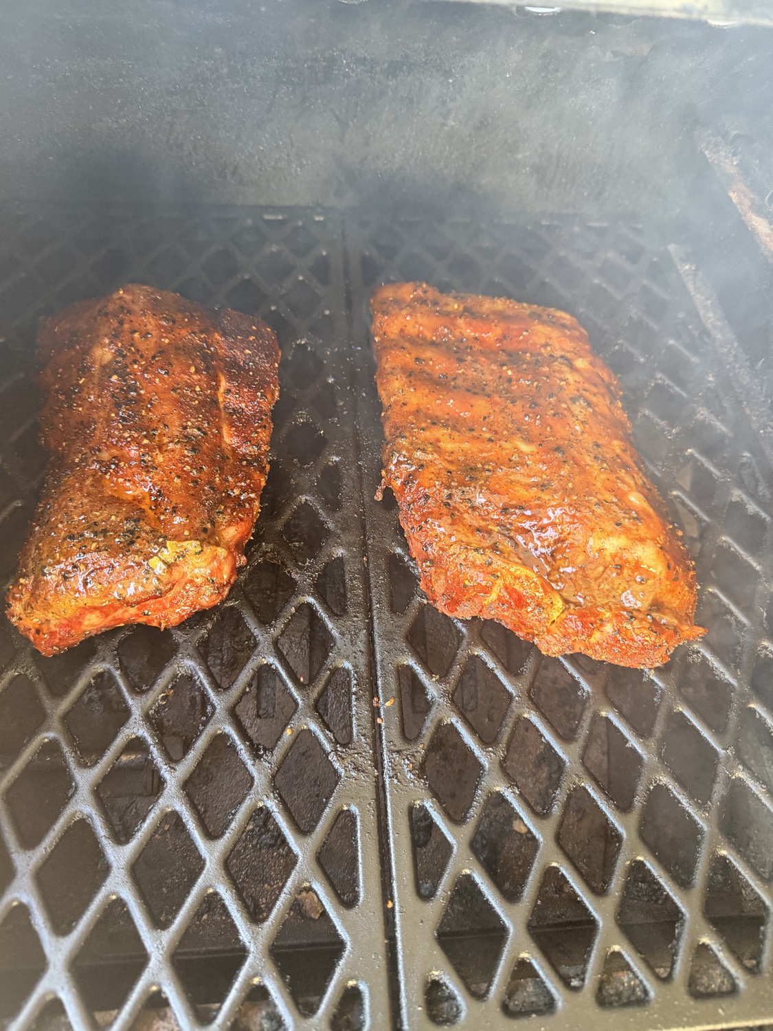 Two racks of ribs smoking low and slow